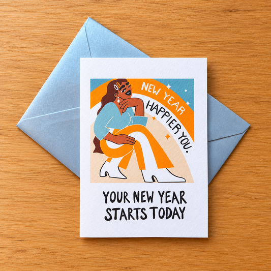New Year, Happier You greeting card by Lo Harris, styled on a table