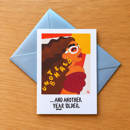 Unbothered greeting card by Lo Harris, styled on a table